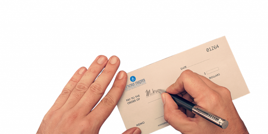 Writing a cheque to the Mikvah Tahara Association