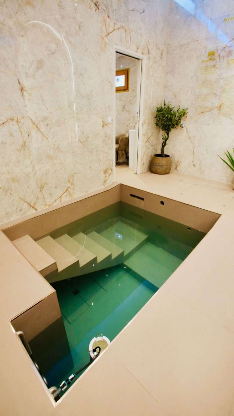 The finished bor tevilla in Ajaccio, Corsica, marble lined with steps down into the water