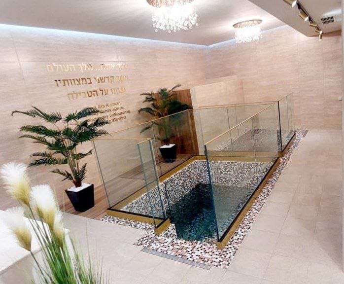 The completed mikvah in Varna, Bulgaria, its bor tevilla set behind a glass balustrade
