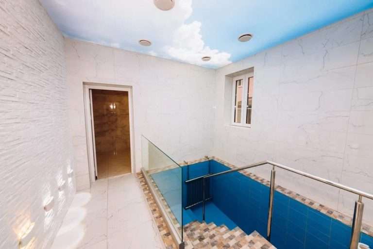 The completed mikvah in Brest, Belarus, with a blue tiled bor tevilla and a painted sky ceiling