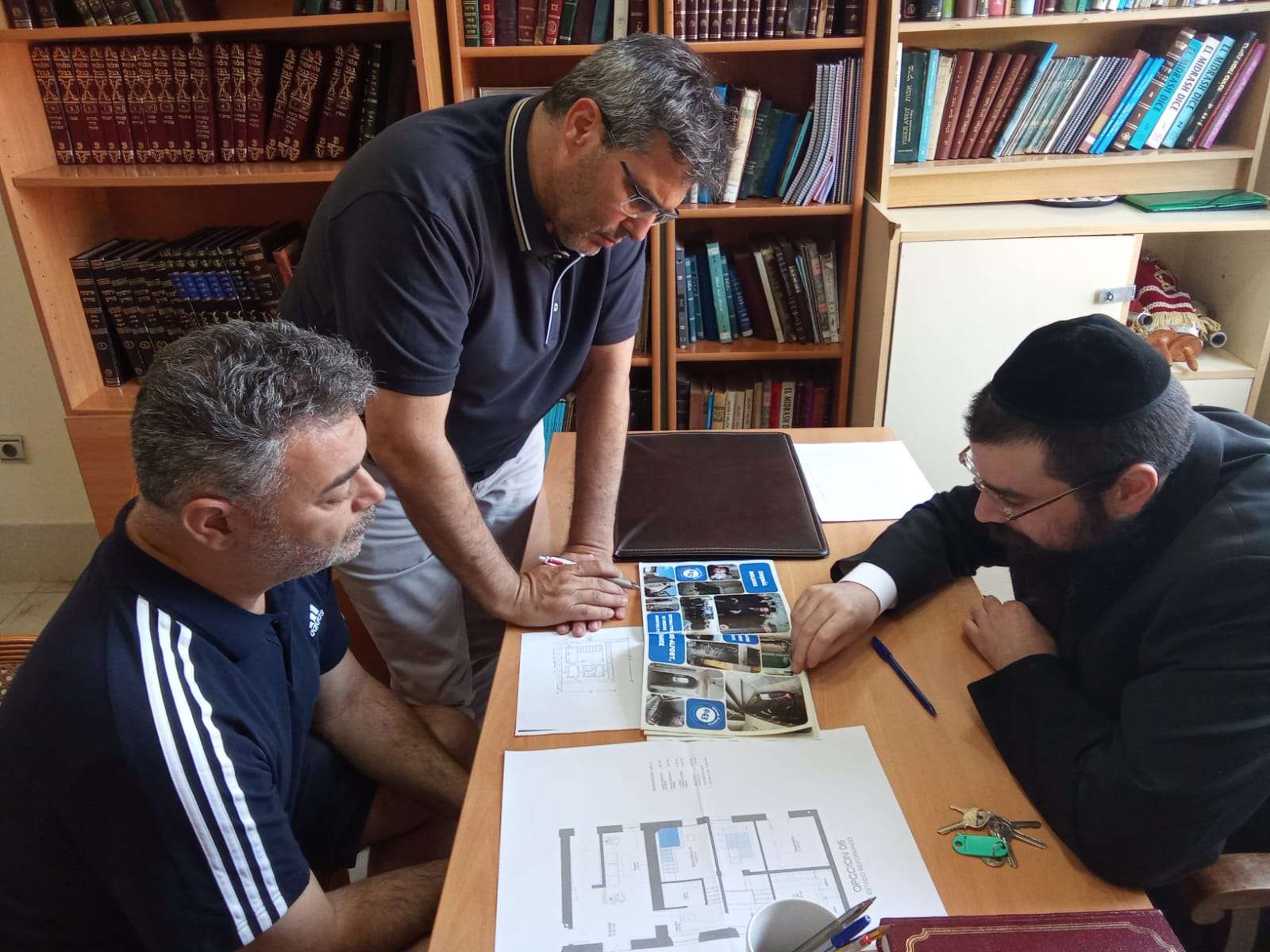 Reviewing the mikvah plans with the community in Melilla, Spain